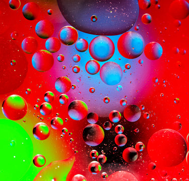 Abstract colorful background from luminous circles of water planets, square