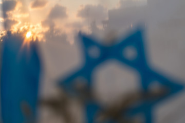 Isolated close up of an Israeli flag background with dried wheat during sunset- Israel Independence day