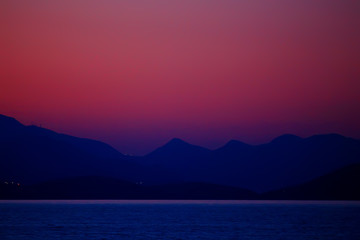 red sunset in the mountains, landscape nature silhouette of mountains at sunset, summer look