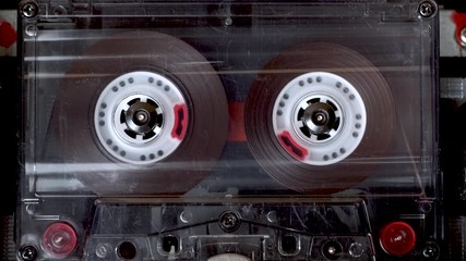 vintage audio cassette plays in tape deck