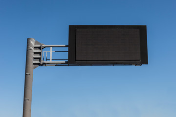 Digital Empty Road Signboard in the blue sky background.