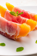 melon cantaloupe with smoked ham and mint