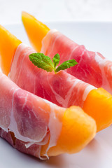 melon cantaloupe with smoked ham and mint