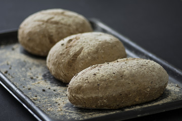 Fototapeta na wymiar Rustic Bread and crumbs on baking tray