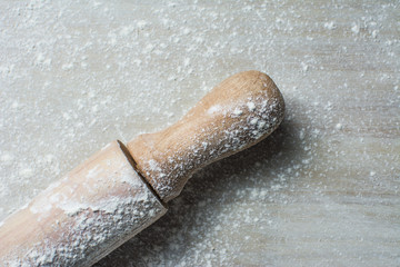 Rolling Pin and Flour on Light Background