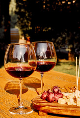 Glasses Of Fine Red Wine With Grape and Cheese