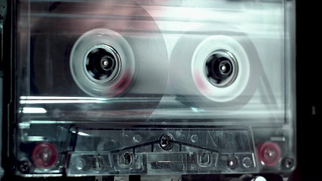 vintage audio cassette fast forwarding and then playback in tape deck