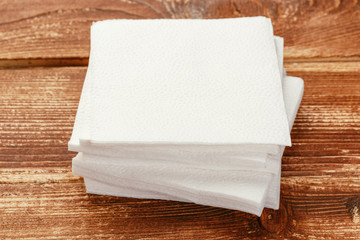 white paper napkin with a textured pattern on an old table