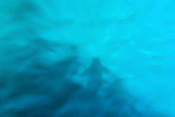 Reflection of shadows on blue water with waves, background