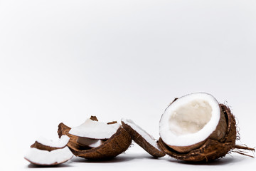 Tropical fruit split coconut abstract background. Coconut on a white background. Selective focus