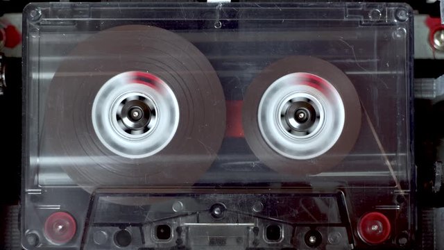 vintage audio cassette fast forwarding  from start to finish in tape deck
