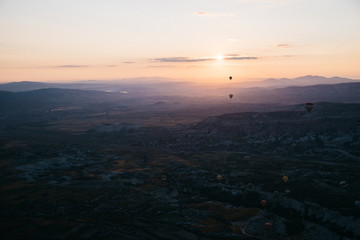 The view from above hot air balloon at sunrise at Cappadocia valley.