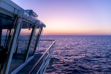 A calm and colorful dusk while sailing aboard a ship