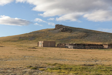 Winter dwelling and corral of the nomadic people on the hills of Mongolia