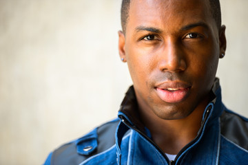 Face of young handsome African man looking at camera