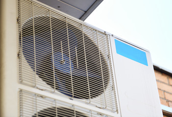 Air conditioning outside the building. Air ventilation system in the house. Climatic equipment....