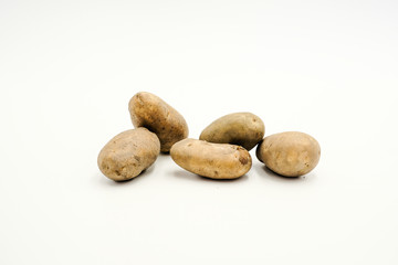 Fototapeta na wymiar Potatoes or Solanum tuberosum, shots on isolated white background.