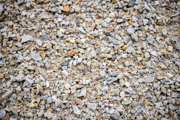Background with gravel, small multi-colored stones. Close up.