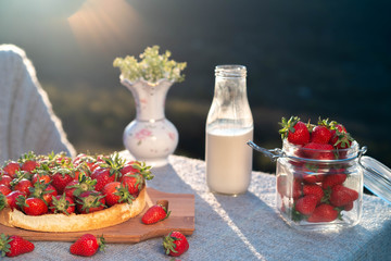 Table on the nature with a view of the mountains in the setting sun.