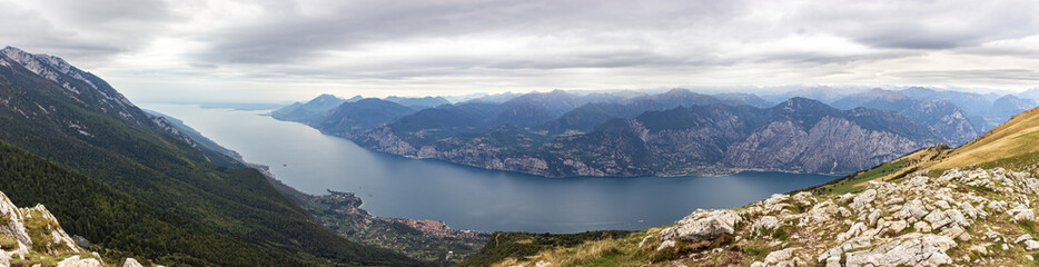 Fototapeta na wymiar View from the heights of Monte Baldo on the Alpine mountains and Lake Garda in Veneto, northern Italy