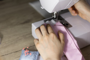 Selective focus on sewing machine was used by a woman,Used sewing machines.