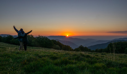 Sunrise over mountain at ballon d'Alsace. People cheering and enjoying the view. France.