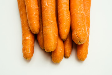 Carrot or Daucus carota subsp. sativus, shots on isolated white background.