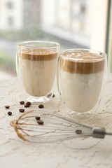 Vertical photo. Trendy Korean coffee drink dalgona coffee