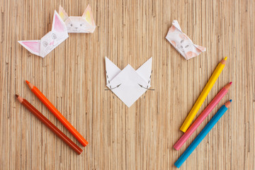 Step by step instructions how to make origami а finger doll cat. Step 6