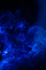 Blue smoke motion on black background.