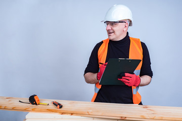 The carpenter clarifies the details of the project and makes not