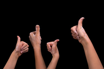 Hands in soap suds on a black background.