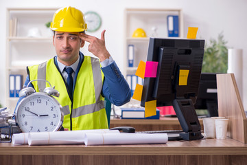 Young male architect working in the office