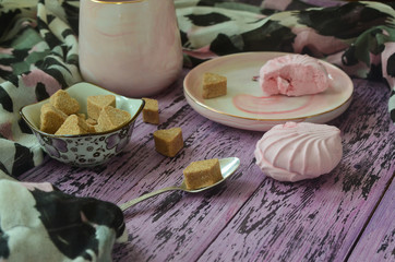 Marshmallows and refined sugar on a wooden table. Morning snack lifestyle indoor
