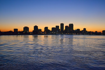 Fototapeta premium city panorama with night light seen from cargo ship