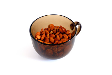 Set of nuts. Almonds and walnuts in a mug on a white background. Suitable for advertising background
