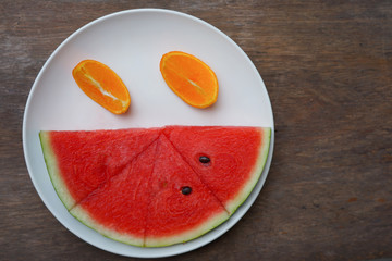 Orange pieces  and red  watermelon good health and sweet decorate on dish fresh fruit in summer