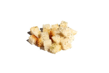 Croutons of white bread on a white background with strong shadow