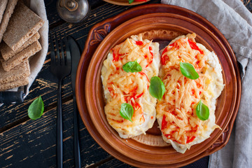 chops with chicken breast, tomatoes, onions and cheese, selective focus