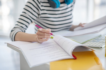 Woman in a striped shirt working with papers