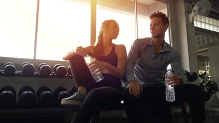 Sportive couple resting after a workout
