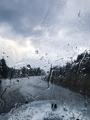 Rain pouring down a car windscreen