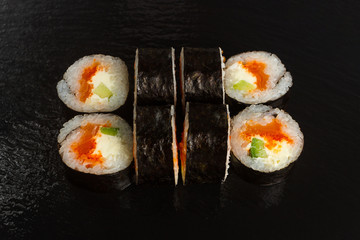 Japanese food: Set of salmon sushi and rolls with salmon and eel