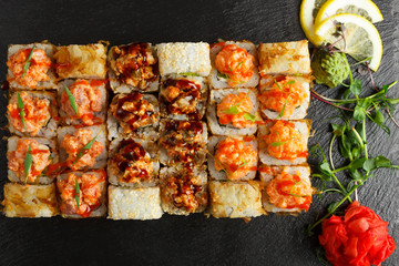 Japanese food: Set of salmon sushi and rolls with salmon and eel