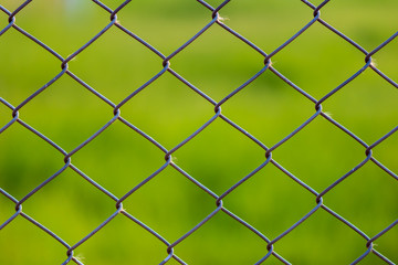 Fototapeta premium Coil, fence, wall, field in the park.