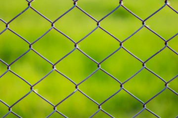 Coil, fence, wall, field in the park.