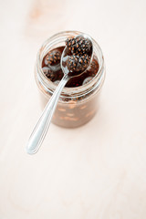 pine cone jam in a glass jar on a pastel background. vegetarian sweet dessert close-up, copy the place for the text. Cold medicine