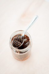 pine cone jam in a glass jar on a pastel background. vegetarian sweet dessert close-up, copy the place for the text. Cold medicine. Close up