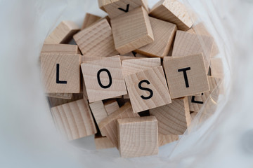 The word Lost in a bag of wooden tiles