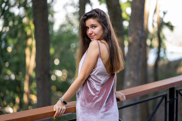 Portrait of a girl in a pink velor dress